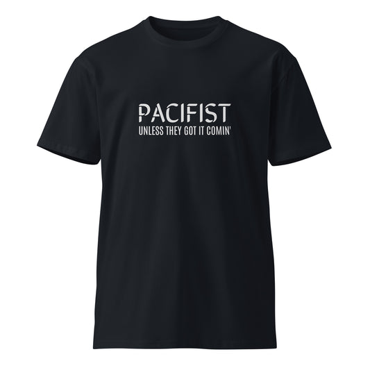 Navy unisex premium T-shirt with "Pacifist. Unless they got it comin'" graphic from wayward.biz, front view.