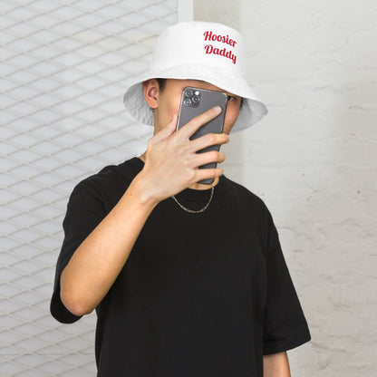 Reversible bucket hat by wayward.biz with all-over white print, showing front outside view and versatile style.