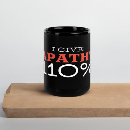 Black glossy 15 oz mug with "I Give Apathy 110%" printed on the front, featuring a sleek wayward.biz design.