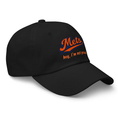 Black dad hat with embroidered pseudo Mets logo on front, featuring "Hey I'm not proud" text, by Wayward.biz.