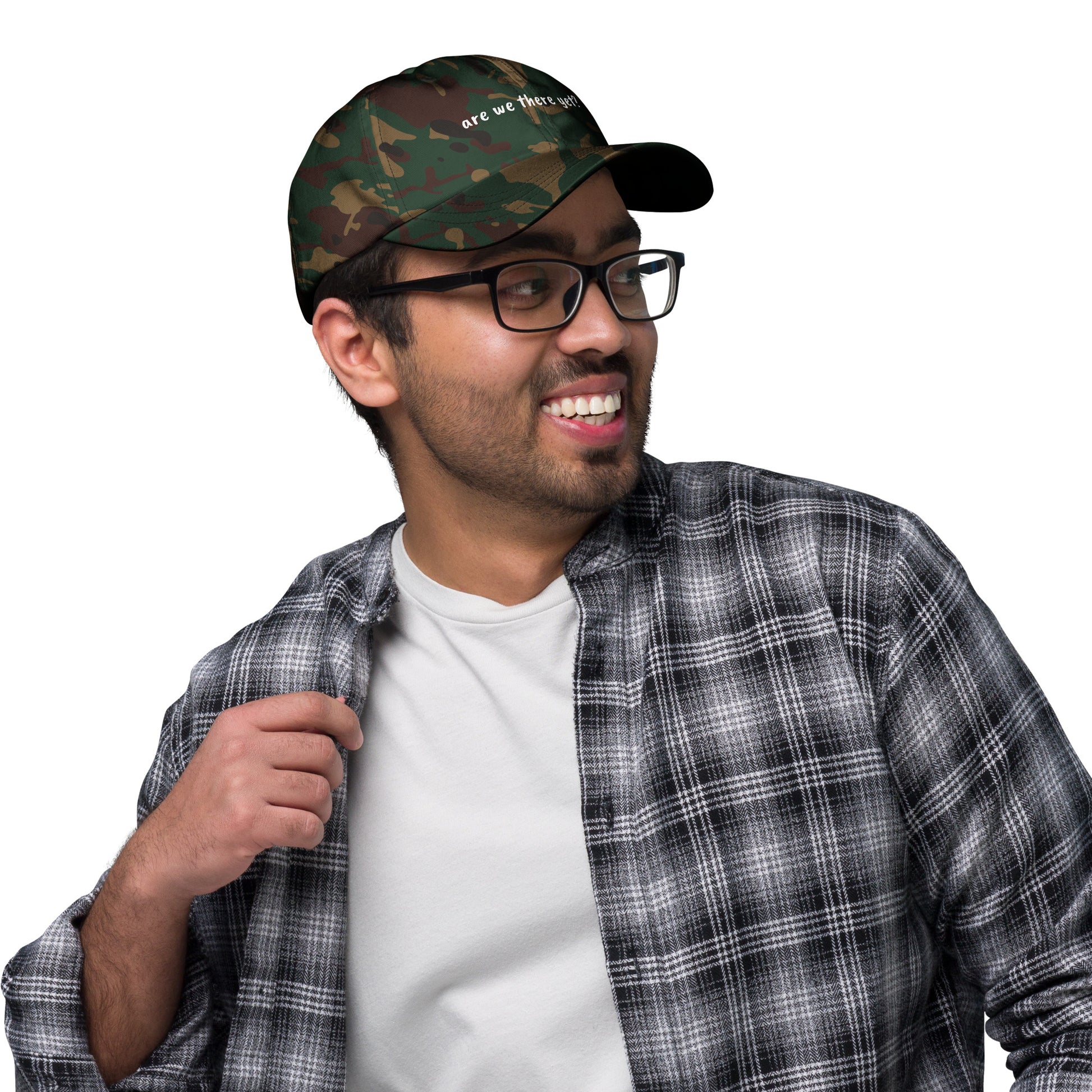 Green camouflage dad hat with "Are We There Yet" embroidered text, casual style, by Wayward.biz.