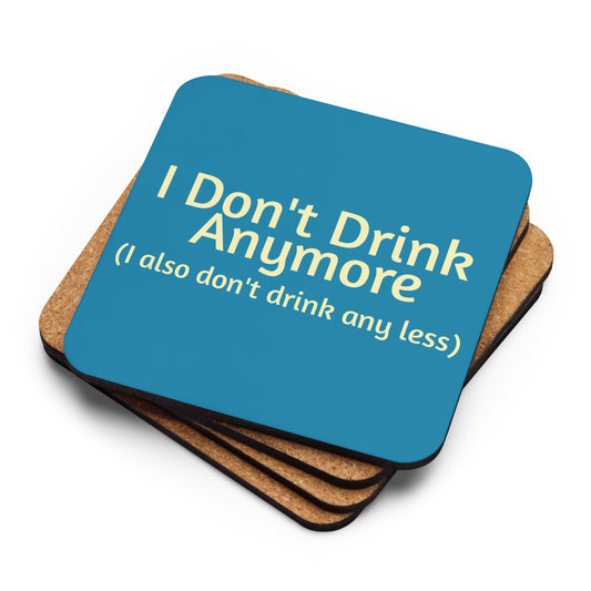 Cork-back sublimation coaster with "I Don't Drink Anymore (or less)" text, featuring a colorful, humorous design on a wooden surface.