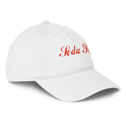 White Soda Pop low-profile baseball cap from wayward.biz, shown from the front right angle, with a curved brim and adjustable strap.