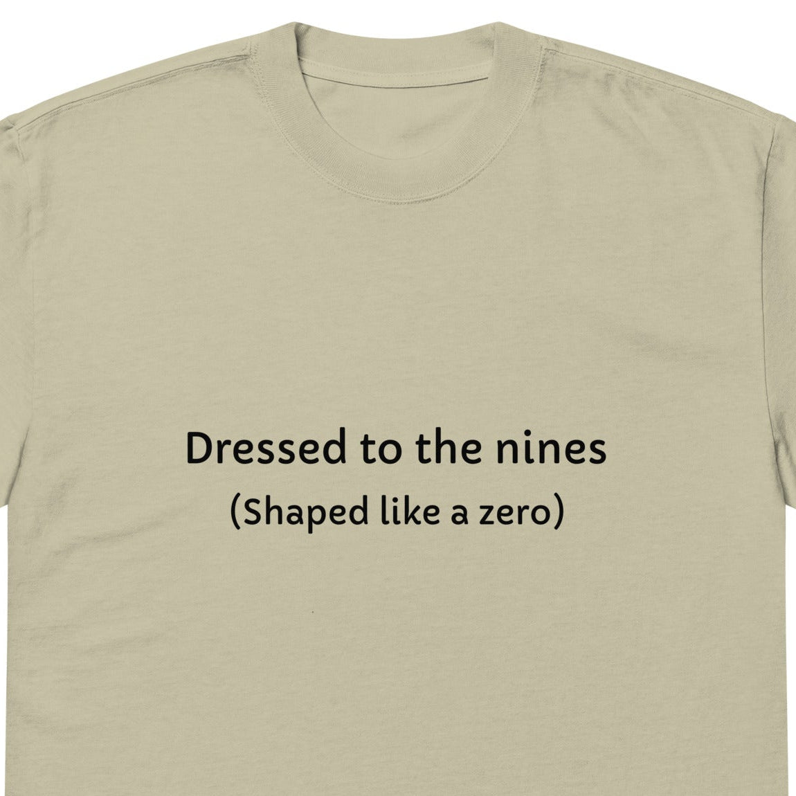 Men's oversized faded eucalyptus T-shirt with embroidered "Dressed to the nines" shaped like a zero, front view.