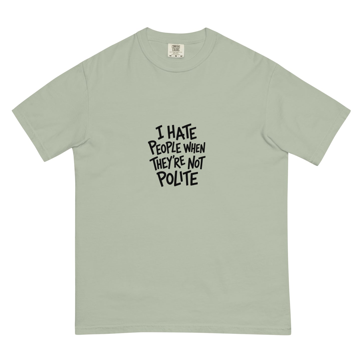 Unisex garment-dyed heavyweight T-shirt featuring "I hate people when they're not polite" slogan in black font on front.
