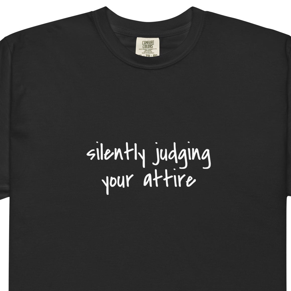 Unisex black garment-dyed heavyweight T-shirt with a relaxed fit, featuring a simple front design, from wayward.biz.