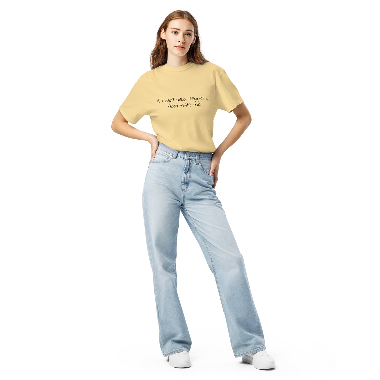 Unisex heavyweight T-shirt by wayward.biz, garment-dyed in butter color, with bold text "If I can't wear slippers, don't invite me" front view.