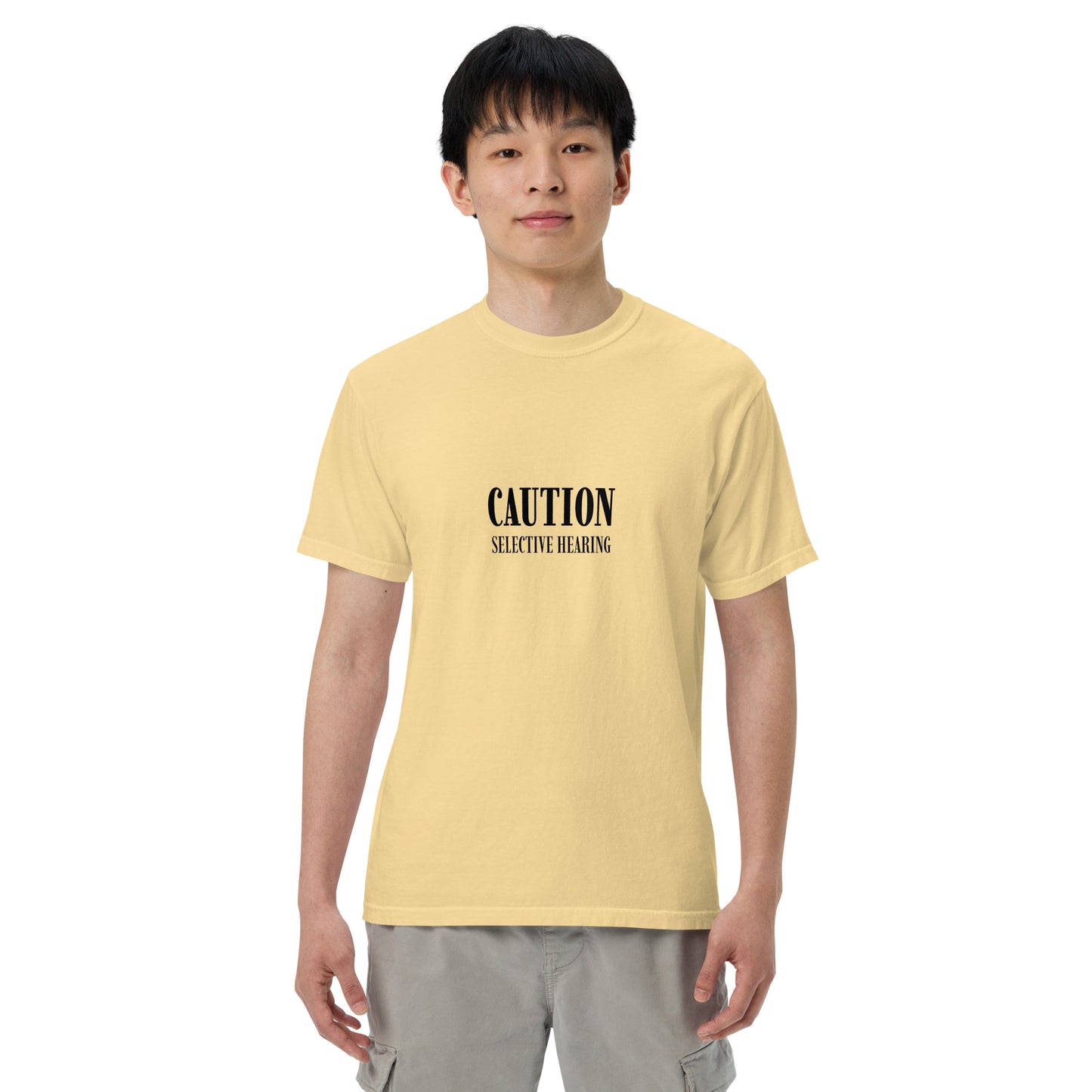 Unisex garment-dyed heavyweight T-shirt with "Caution: Selective Hearing" print, styled in butter color, by Wayward.biz