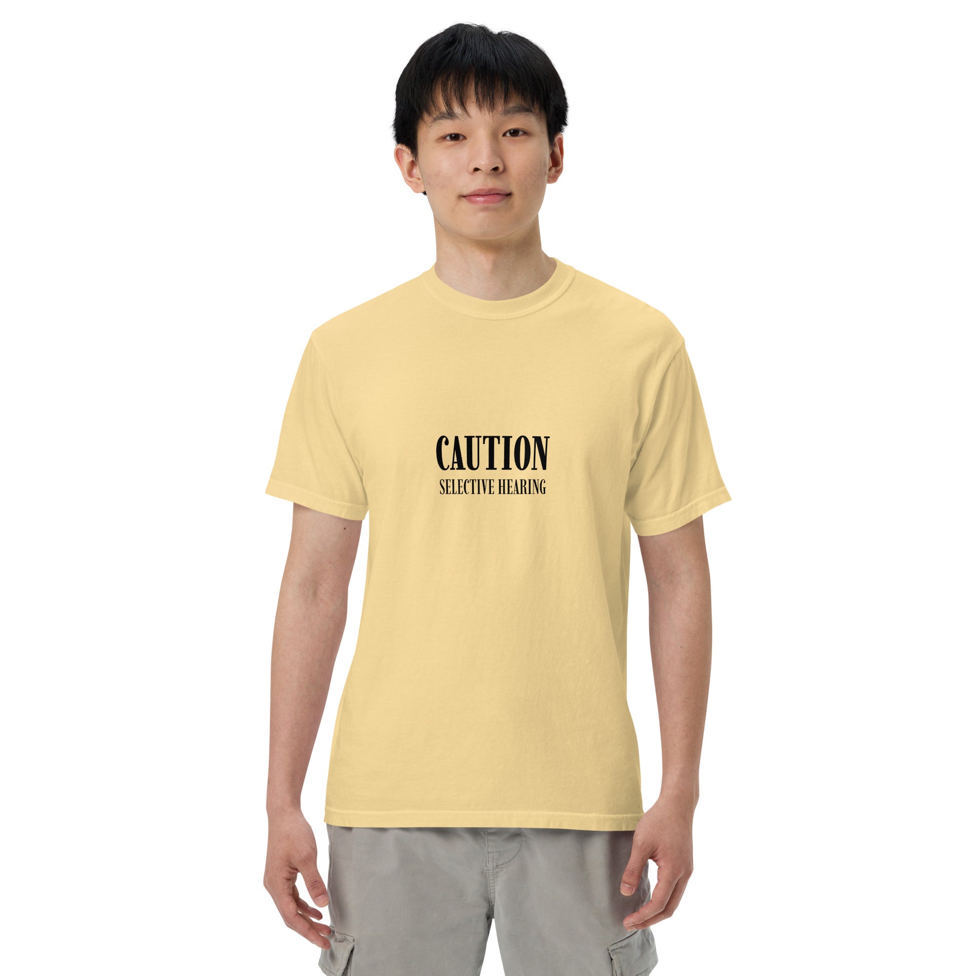 Unisex garment-dyed heavyweight T-shirt with "Caution: Selective Hearing" print, styled in butter color, by Wayward.biz