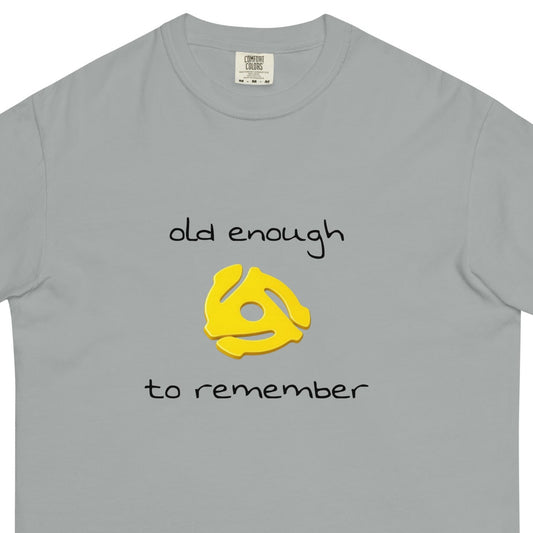 Unisex heavyweight garment-dyed T-shirt with "Old enough to remember" 45 record insert design in granite color, front view.