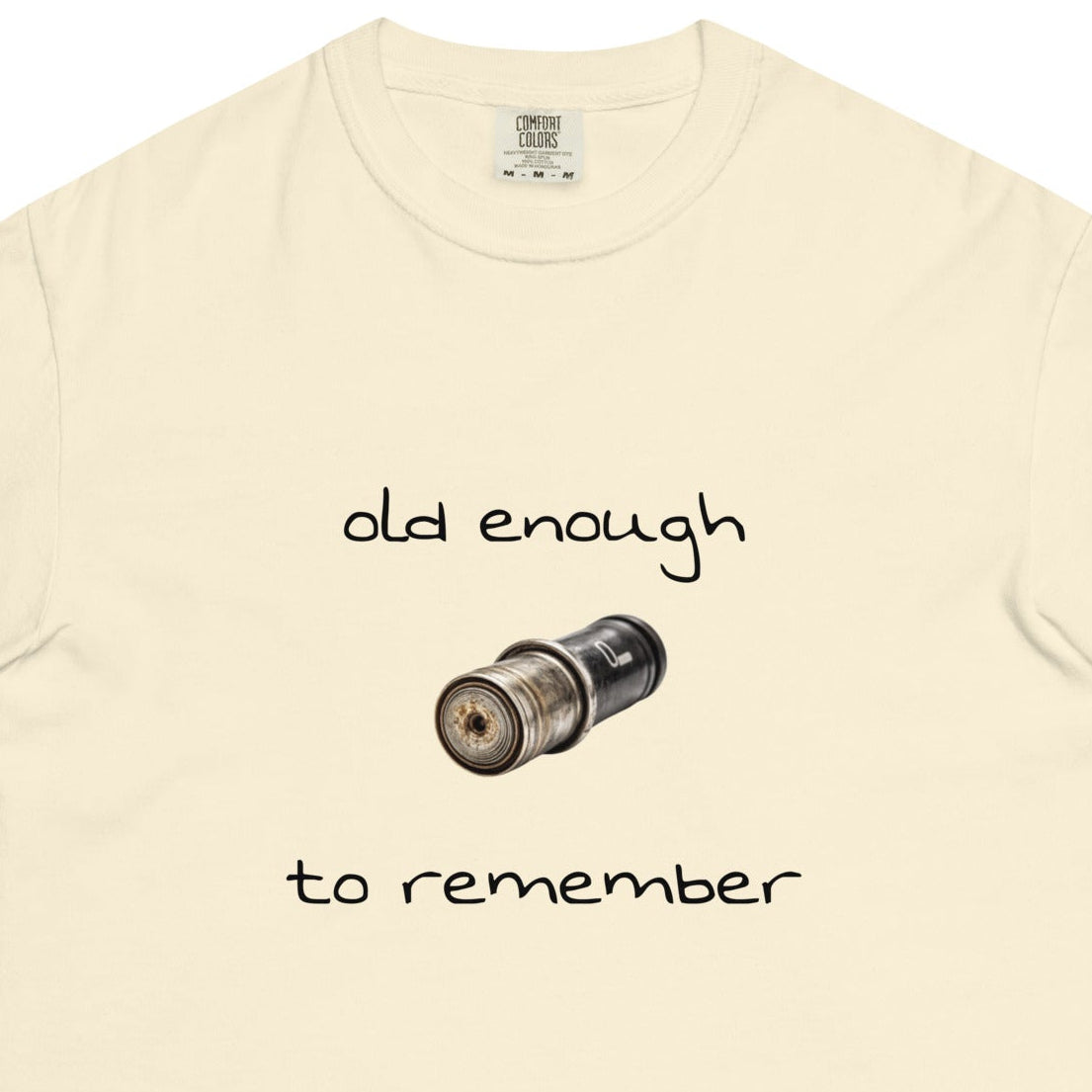 Unisex garment-dyed heavyweight t-shirt in ivory with "Old enough to remember" print, casual style, from Wayward.biz.