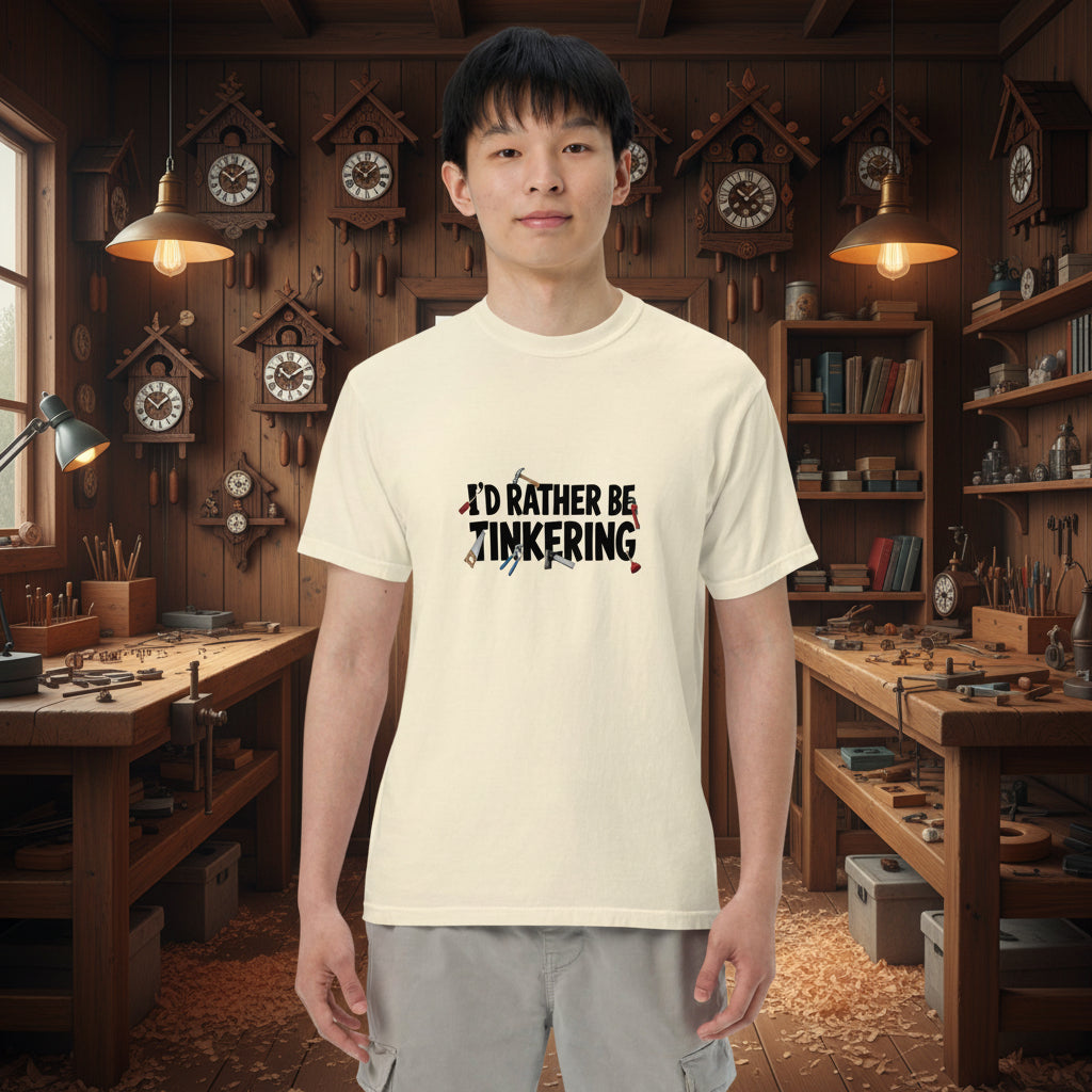 Unisex ivory garment-dyed heavyweight T-shirt with "I'd rather be tinkering" graphic from wayward.biz, front view.