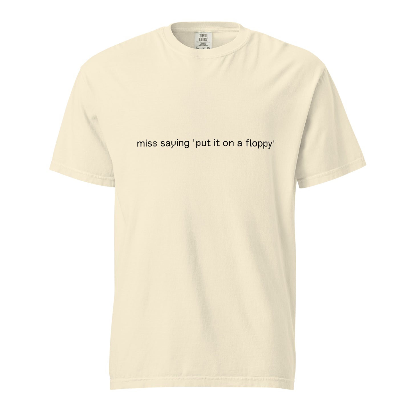 Unisex garment-dyed heavyweight ivory T-shirt with "Put it on a floppy" graphic from wayward.biz, front view.