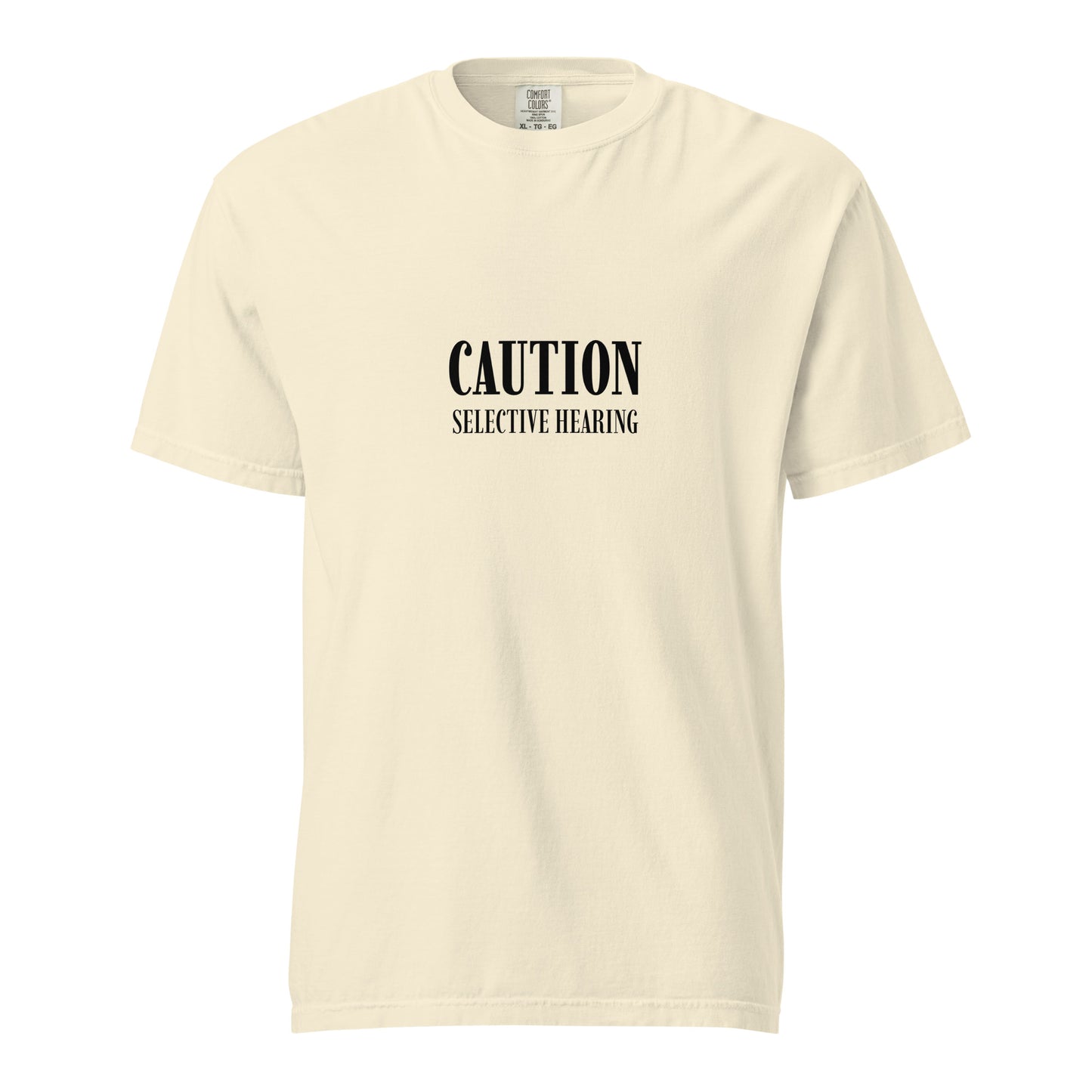 Unisex garment-dyed heavyweight T-shirt in ivory with caution: selective hearing printed front, by wayward.biz.