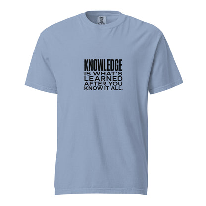 Unisex garment-dyed heavyweight T-shirt with washed denim finish, featuring the phrase "Knowledge is what's learned after you know it all."