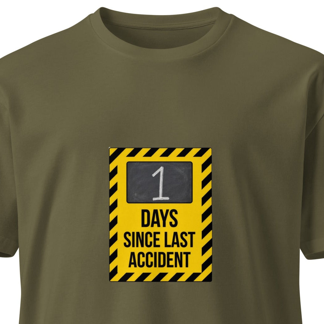 Unisex premium T-shirt with "1 Day Since Last Accident" slogan on front, in army green color, by wayward.biz.