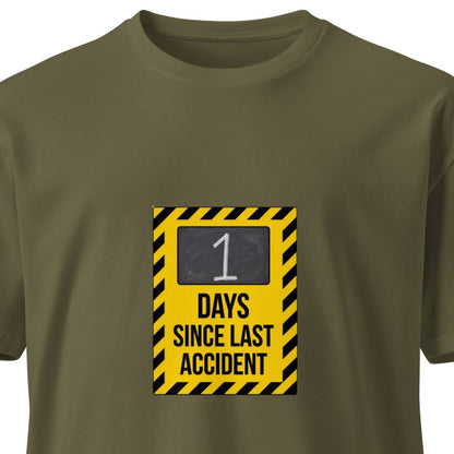 Unisex premium T-shirt with "1 Day Since Last Accident" slogan on front, in army green color, by wayward.biz.