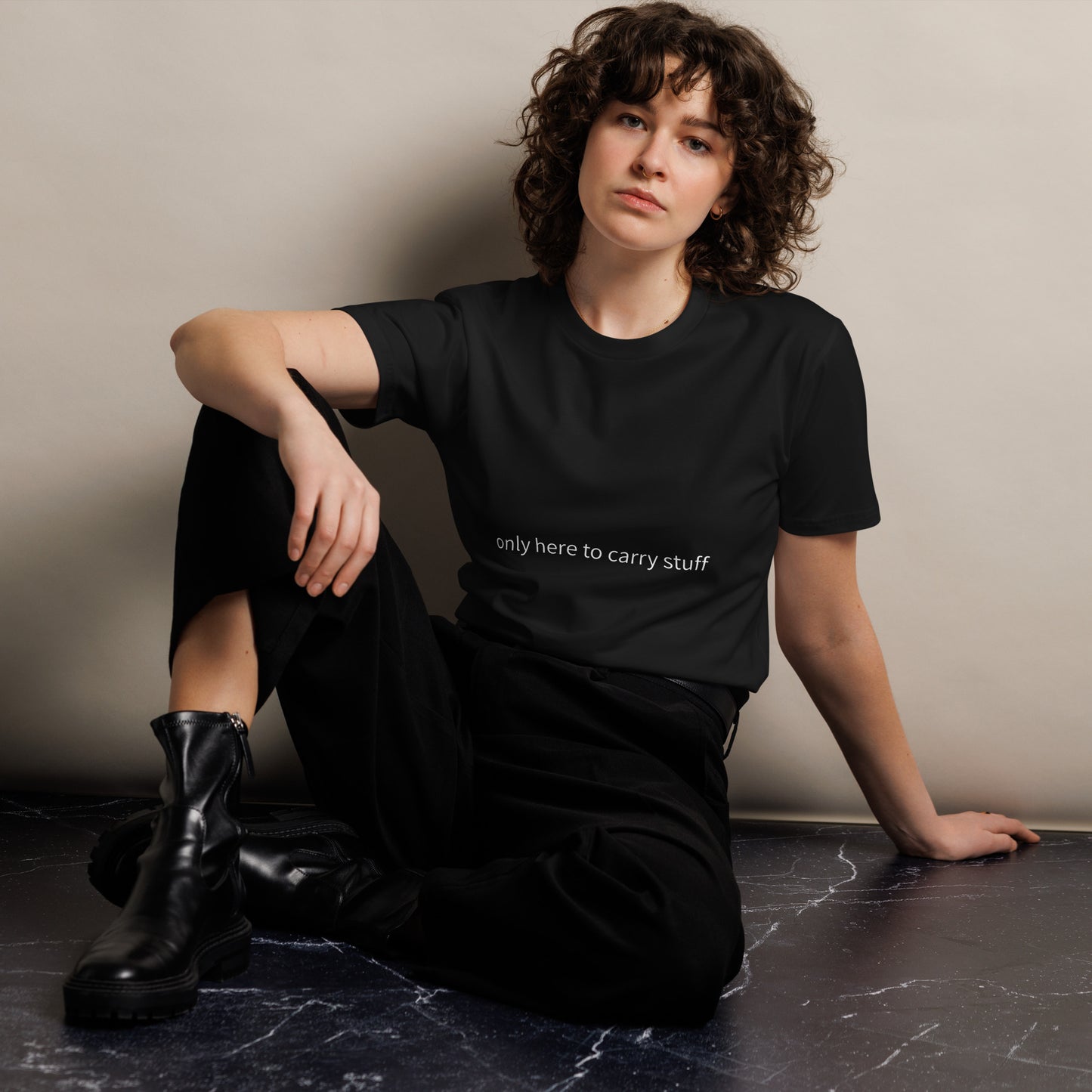 Black Wayward.biz shopping t-shirt, unisex premium cotton tee with "only here to carry stuff" print, front view.