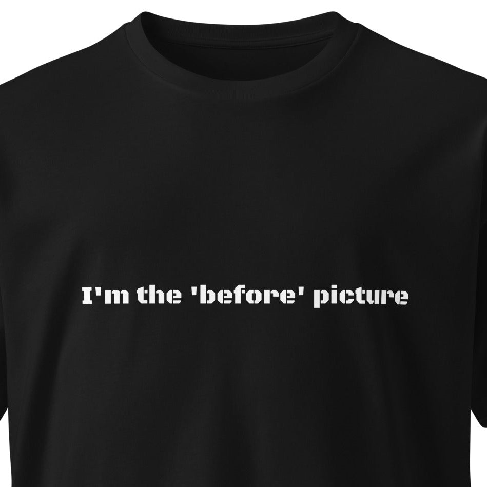 Black unisex premium T-shirt with "I'm the 'before' picture" slogan from wayward.biz, front view, casual fit.