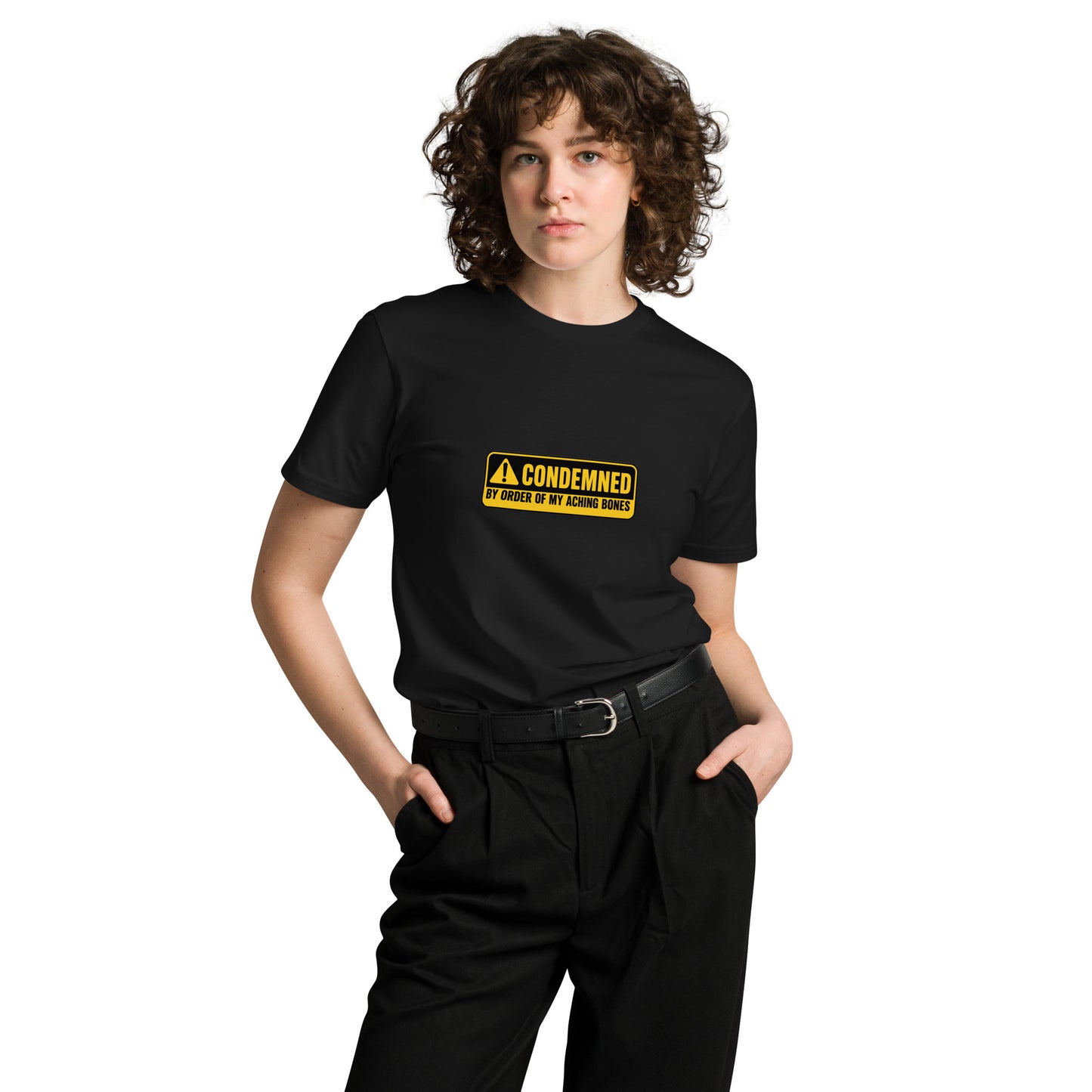 Black unisex premium t-shirt featuring the "Condemned by Order of My Aching Bones" design from wayward.biz, front view.