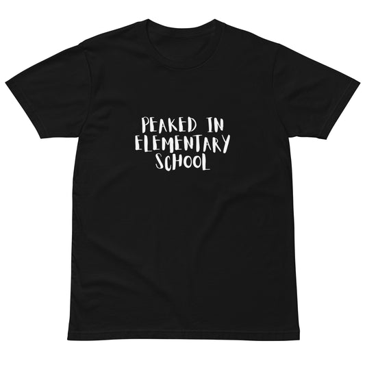 Unisex dark premium T-shirt with "Peaked in Elementary School" graphic, made by wayward.biz, front view.
