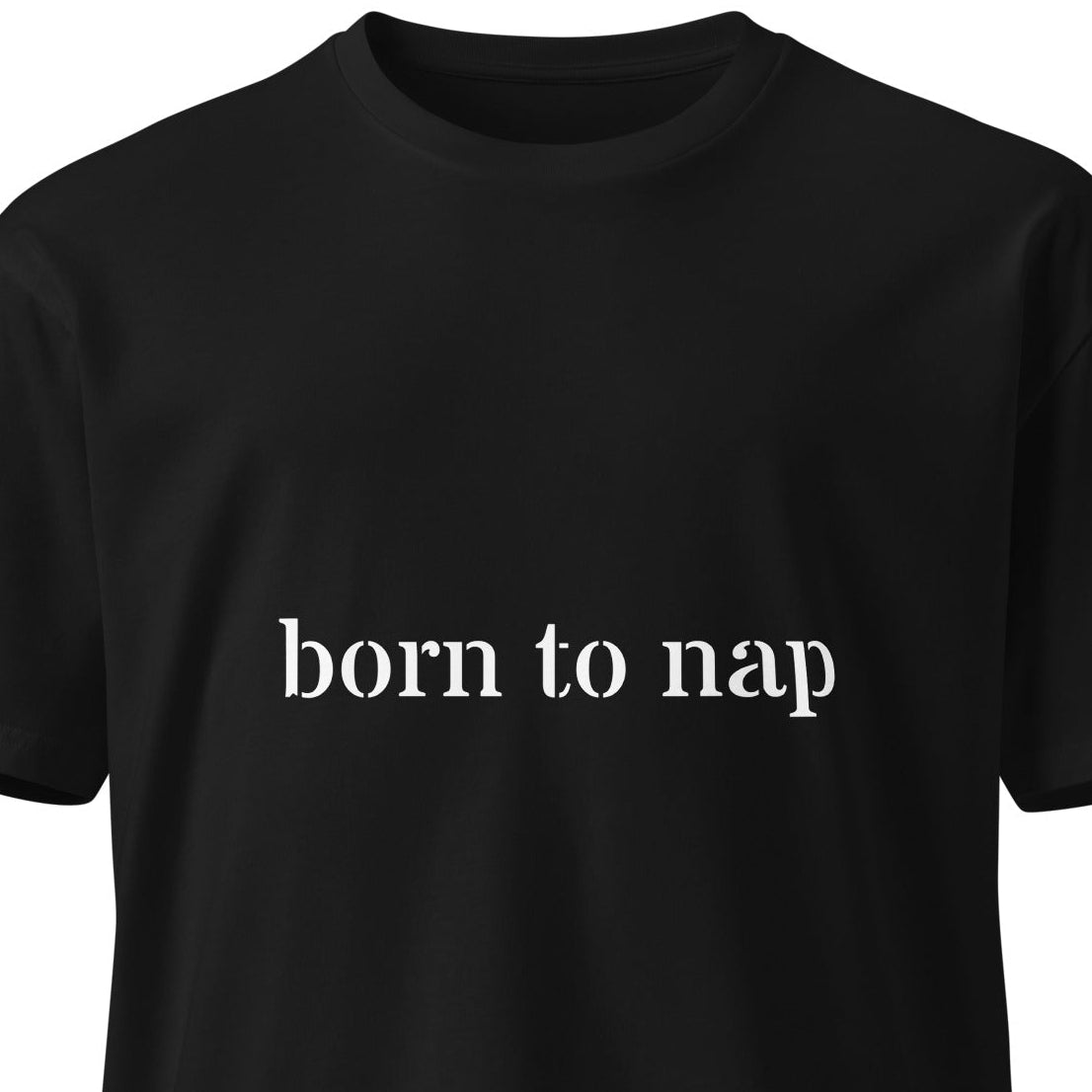 Black unisex premium t-shirt with "Born to Nap" slogan, featuring a simple front design, by Wayward.biz.