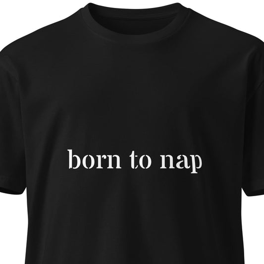Black unisex premium t-shirt with "Born to Nap" slogan, featuring a simple front design, by Wayward.biz.