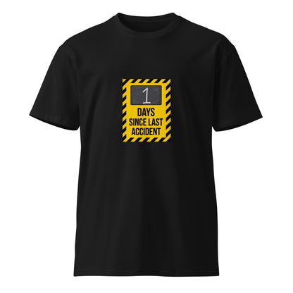 Black unisex premium T-shirt with "1 Day Since Last Accident" graphic, from Wayward.biz, front view.