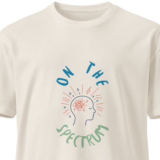 Unisex premium light T-shirt with "On the Spectrum" print in bone color, featuring a front design from wayward.biz.