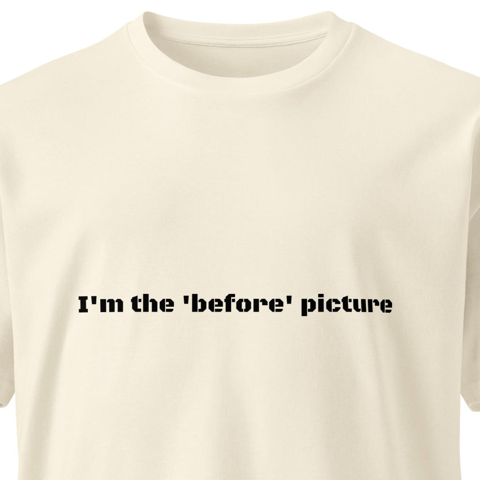 Unisex light premium T-shirt by wayward.biz with "I'm the 'before' picture" text, natural color, front view.