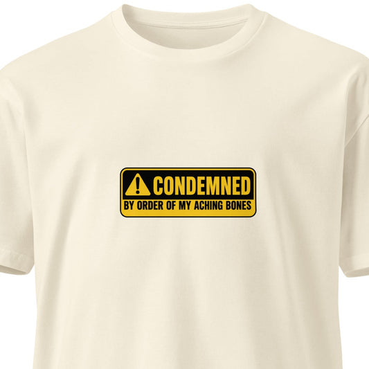 Unisex premium T-shirt with "Condemned by Order of My Aching Bones" design, natural front view, by wayward.biz