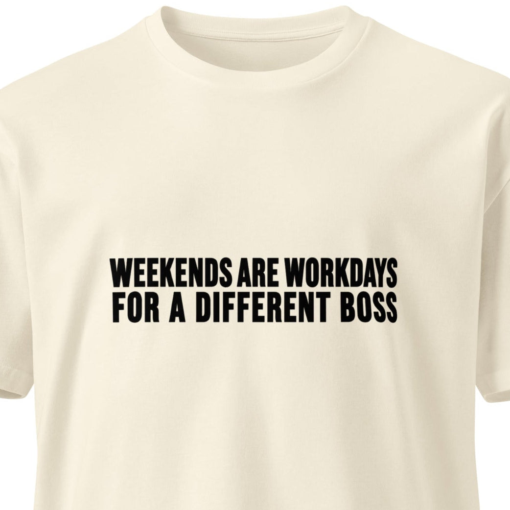 Unisex light premium T-shirt by wayward.biz with "Weekends are workdays for a different boss" slogan, natural front view.
