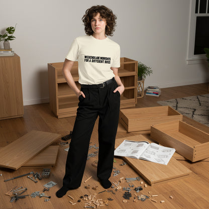 Unisex light premium T-shirt by wayward.biz with "Weekends are workdays for a different boss" printed on the front.