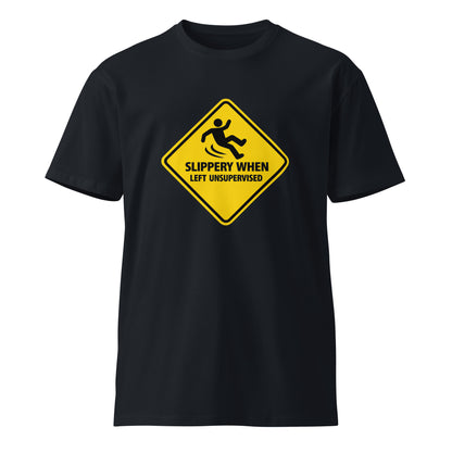 Unisex navy premium T-shirt from wayward.biz with "Slippery When Left Unsupervised" print on front, casual and comfortable style.