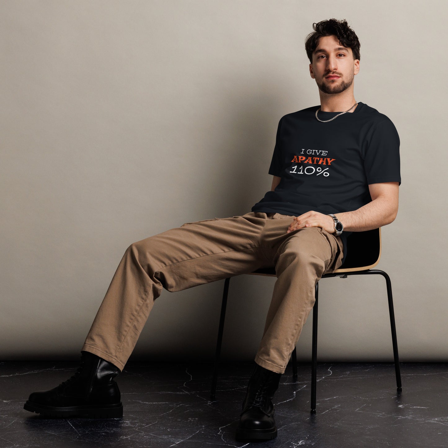 Unisex dark navy premium T-shirt by wayward.biz with "I Give Apathy 110%" graphic on front.