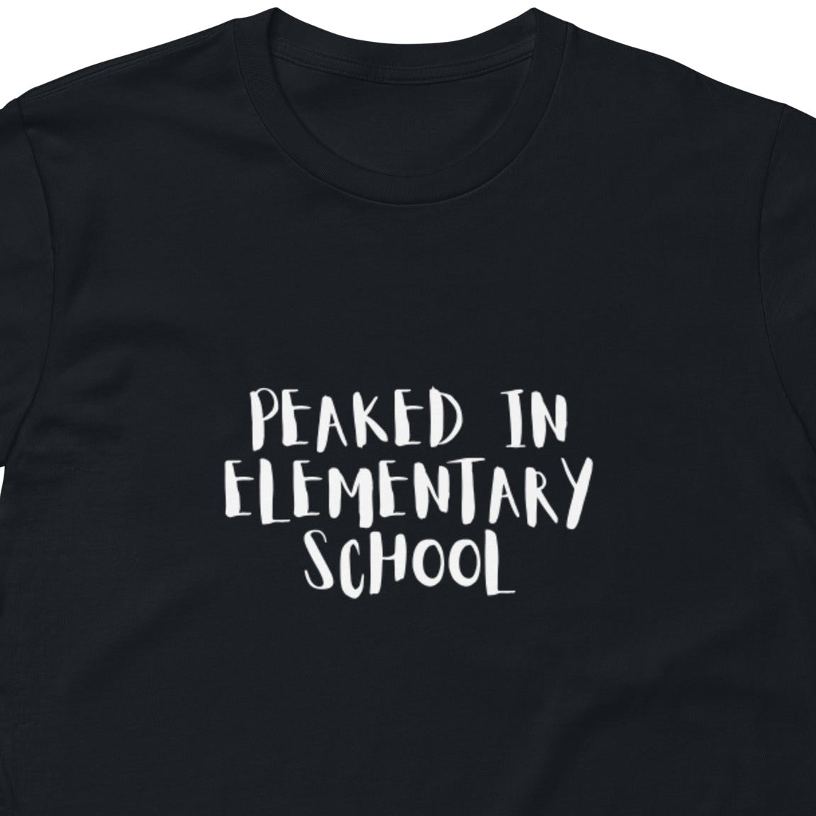 Unisex navy premium T-shirt with "Peaked in Elementary School" graphic, casual fit, and short sleeves, from wayward.biz.