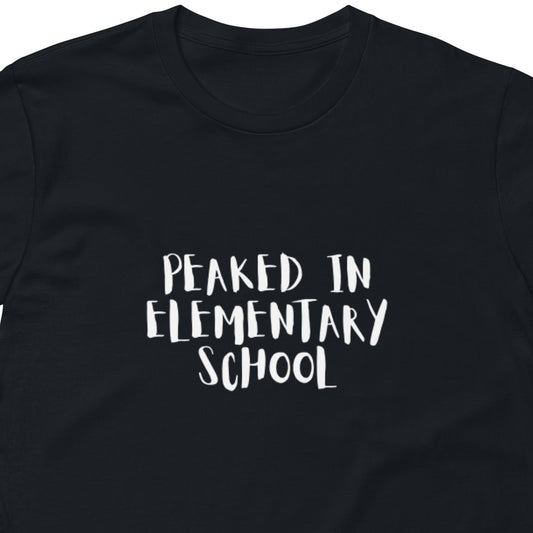 Unisex navy premium T-shirt with "Peaked in Elementary School" graphic, casual fit, and short sleeves, from wayward.biz.