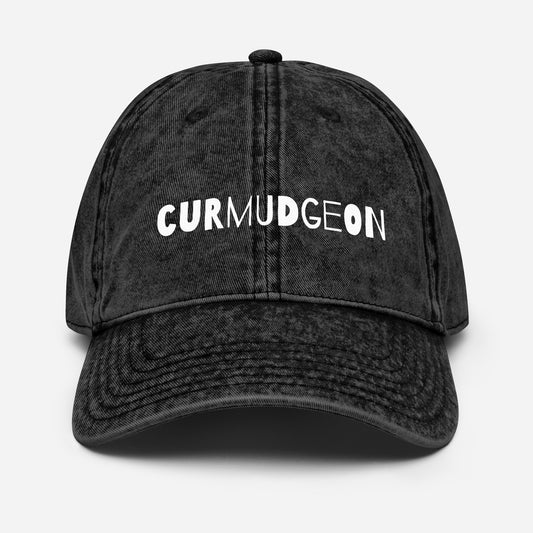 Black vintage cotton twill cap with curved brim, classic style, from Wayward.biz, featuring a worn-in, timeless design.