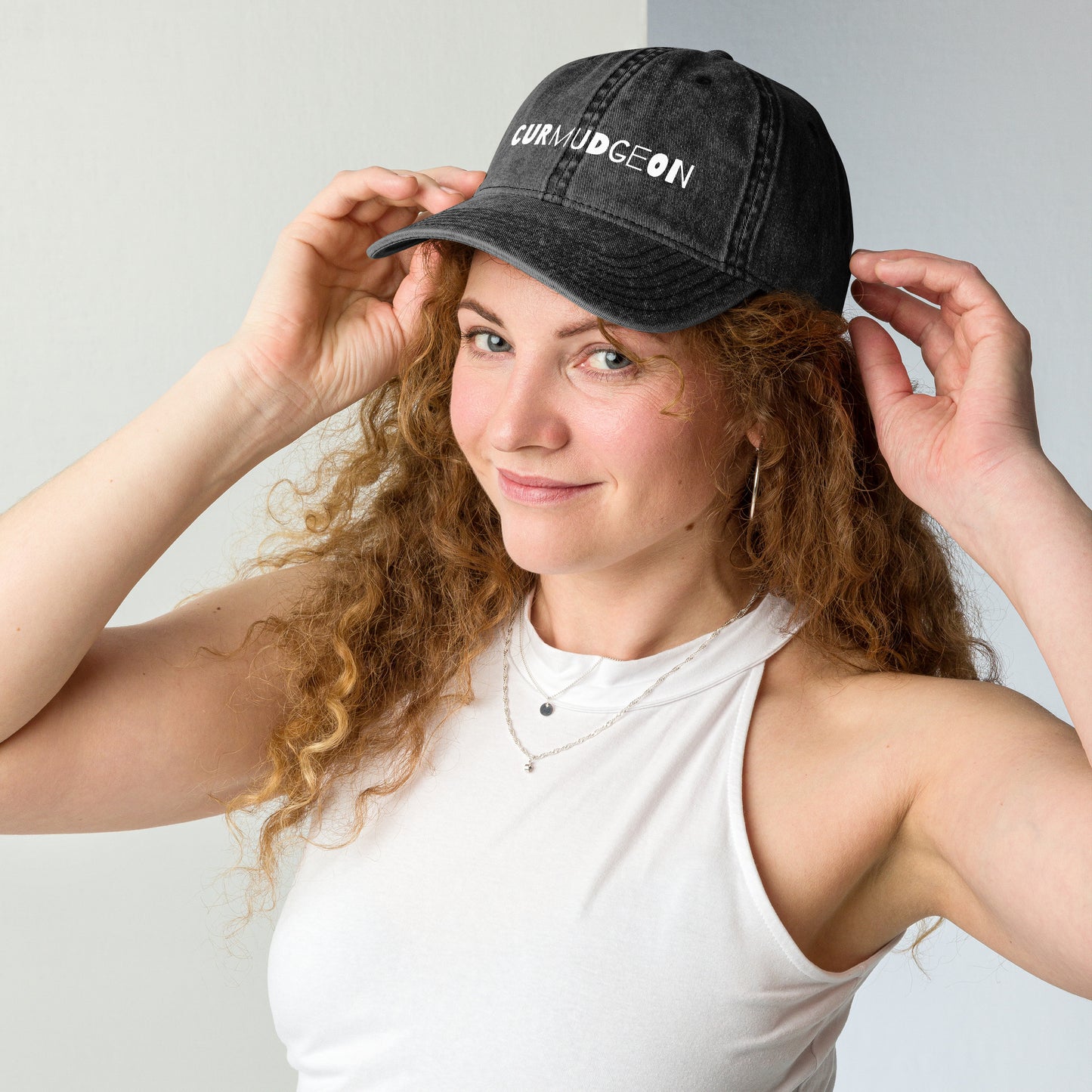 Black vintage cotton twill cap with curved brim, featuring a classic design and Wayward.biz branding on the front.