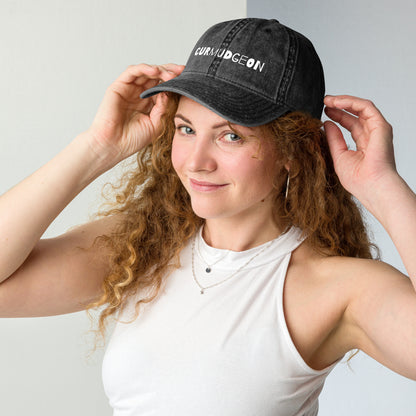 Black vintage cotton twill cap with curved brim, featuring a classic design and Wayward.biz branding on the front.